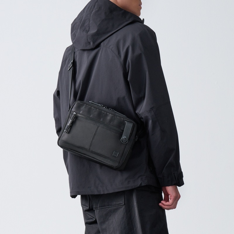 【sjy】POTER メッセンジャーバッグ ブラック PORTER INTERNATIONAL NEW HEAT Shoulder Bag - JET BLACK｜EVA SKY SHOP